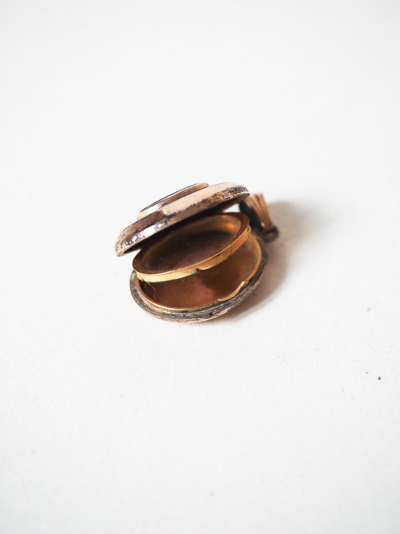 Médaillon religieux ancien qui s'ouvre pour photo – Plaqué or – Cabochon violet – Objet secret